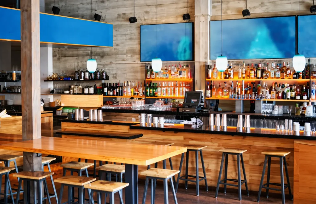 Warm modern restaurant interior with custom woodwork by KingCraft Builders