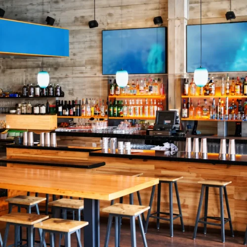 Warm modern restaurant interior with custom woodwork by KingCraft Builders