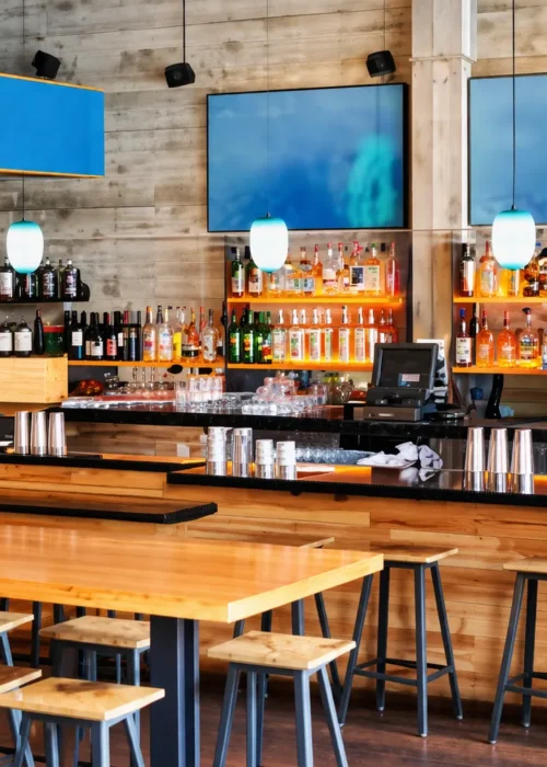 Warm modern restaurant interior with custom woodwork by KingCraft Builders