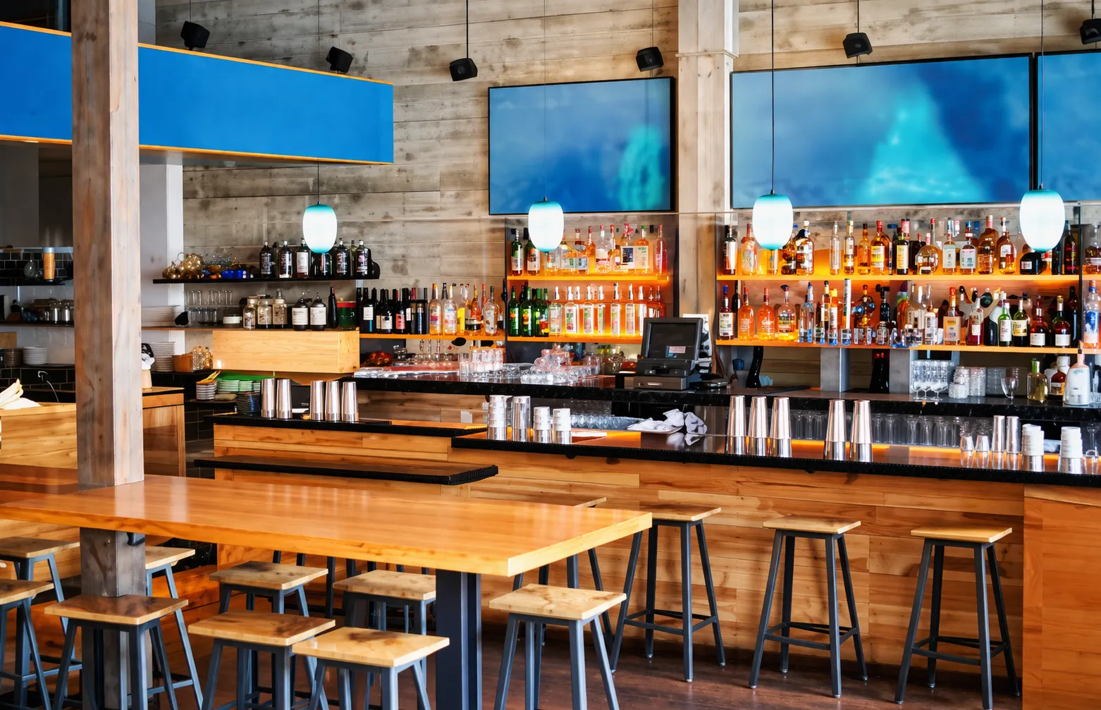 Warm modern restaurant interior with custom woodwork by KingCraft Builders